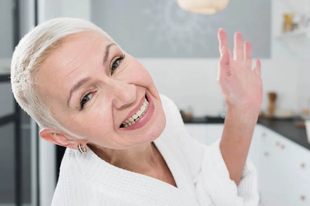 a related image to Laser Treatment - elderly woman posing smiling wide 23 2148419305